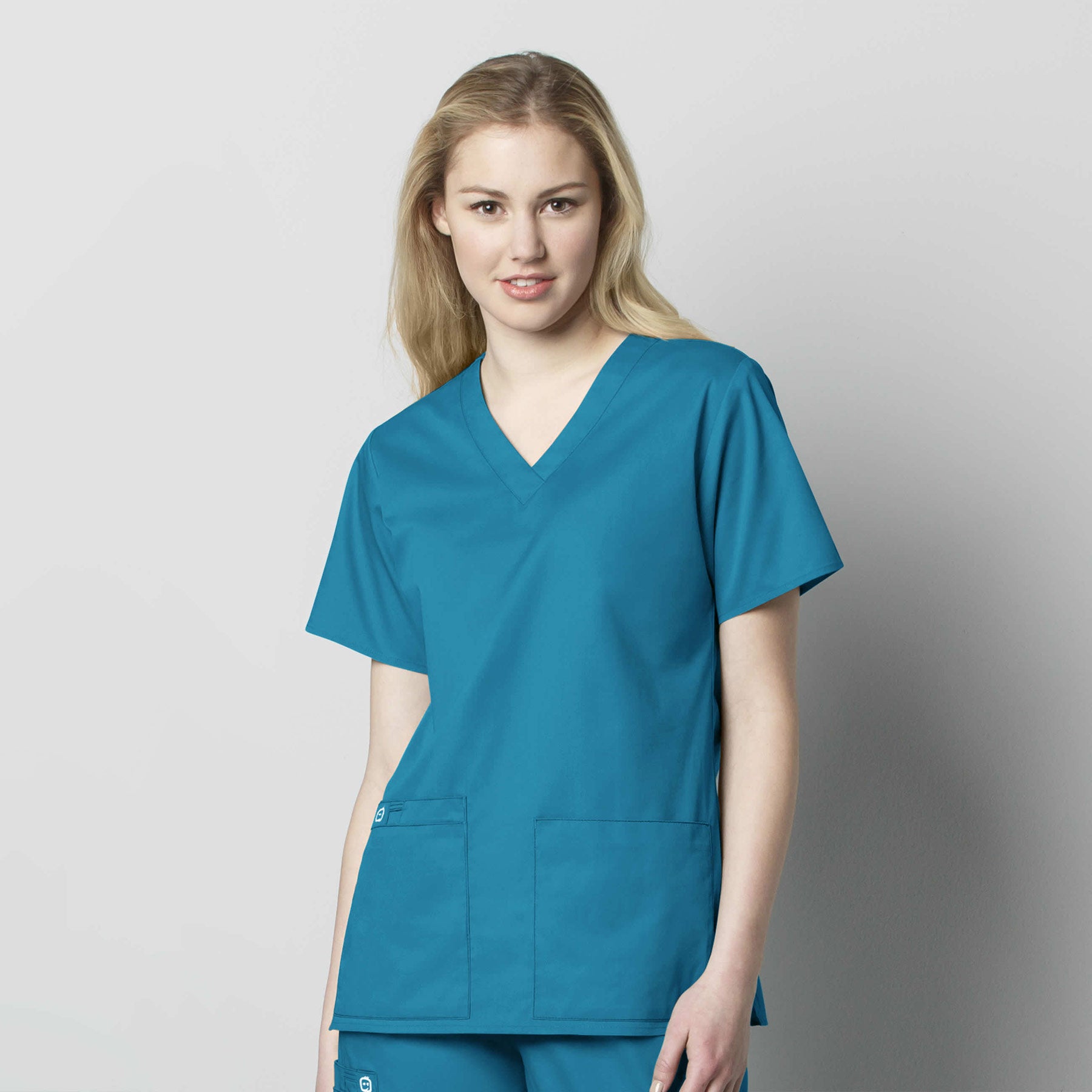 WonderWORK 101 V-Neck Scrub Top Teal Blue Model Image Front | Wink