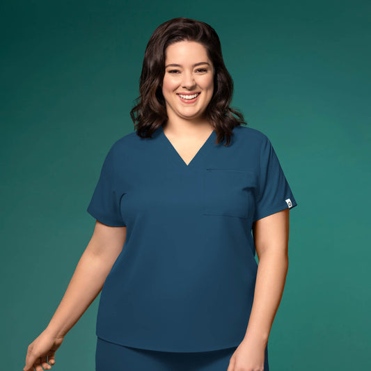 Thrive 6222 V-Neck Tuck-In Scrub Top Caribbean Blue Model Image Front | Wink