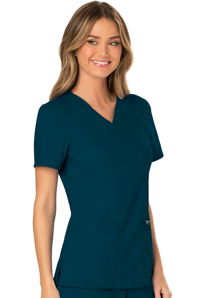 Revolution WW610 Mock Wrap Top Caribbean Blue Model Image Left Side | Cherokee Workwear