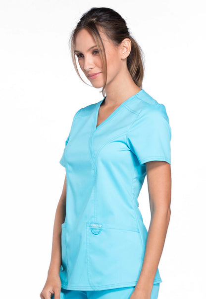 Revolution WW610 Mock Wrap Top Turquoise Model Image Right Side | Cherokee Workwear