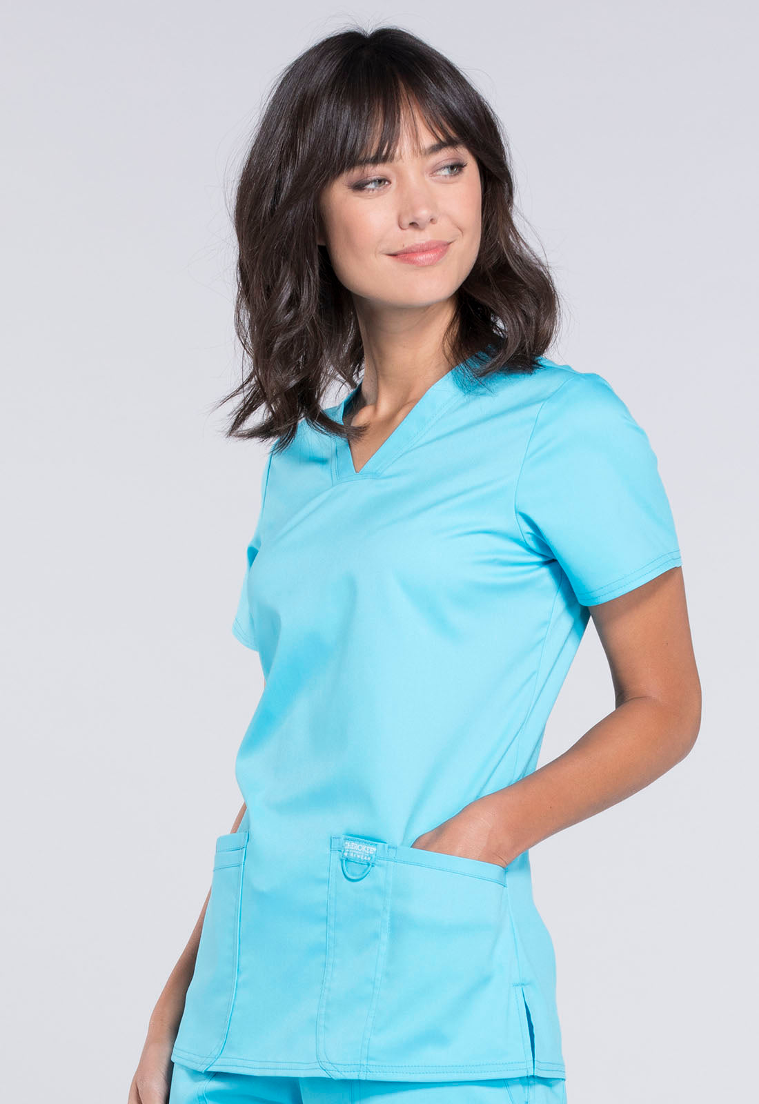 Revolution WW620 V-Neck Top Turquoise Model Image Right Side | Cherokee Workwear