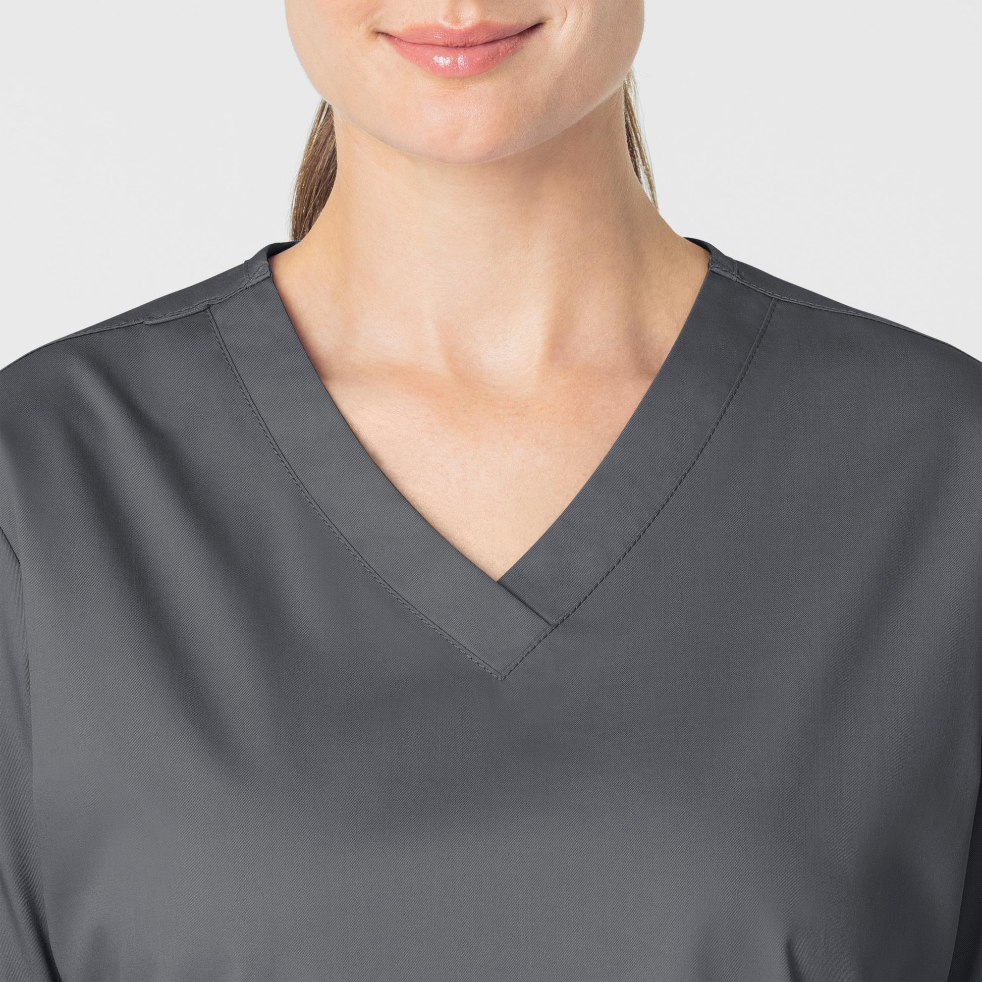 WonderWORK 101 V-Neck Scrub Top Pewter Model Image Left Side | Wink