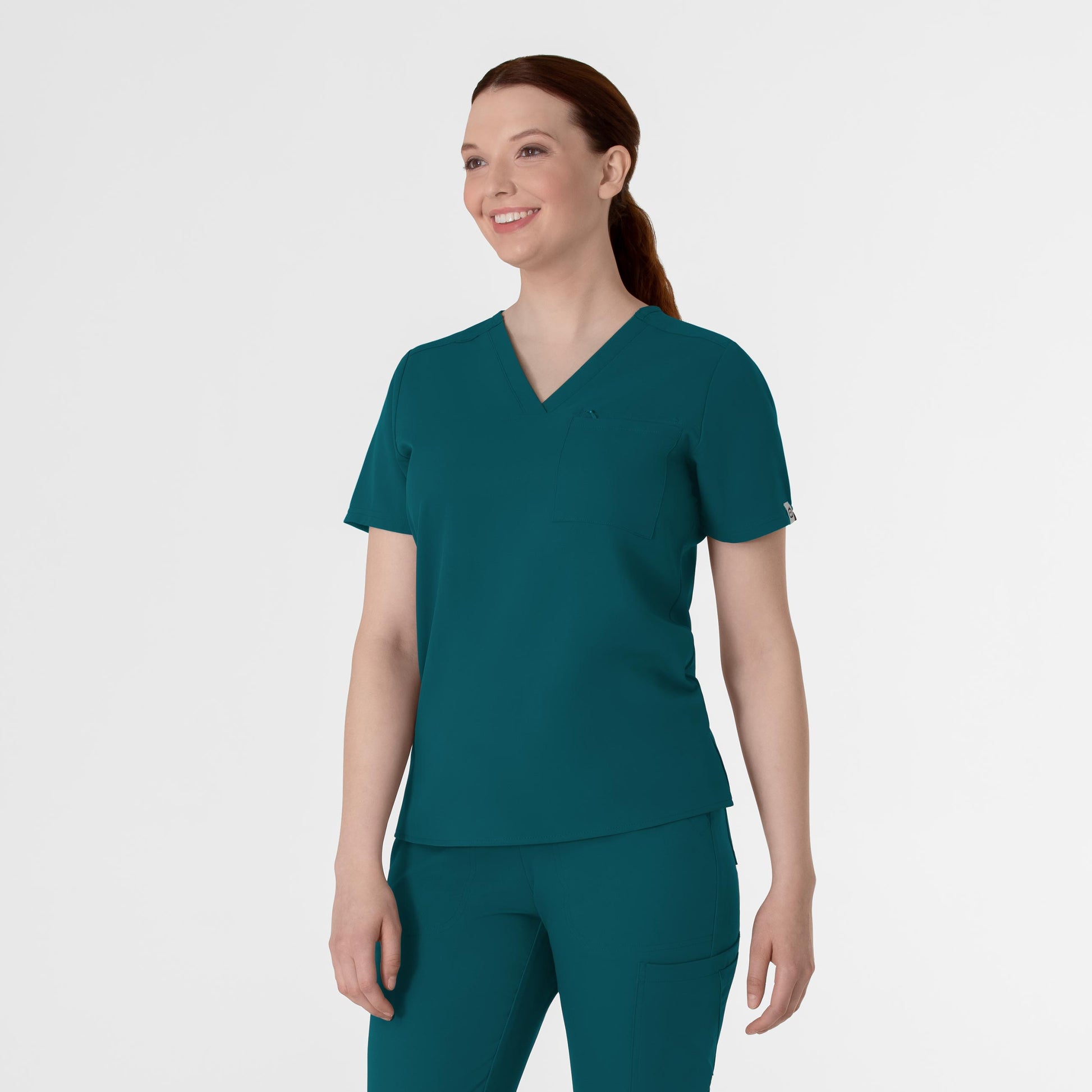 Thrive 6222 V-Neck Tuck-In Scrub Top Caribbean Blue Model Image Right Side | Wink