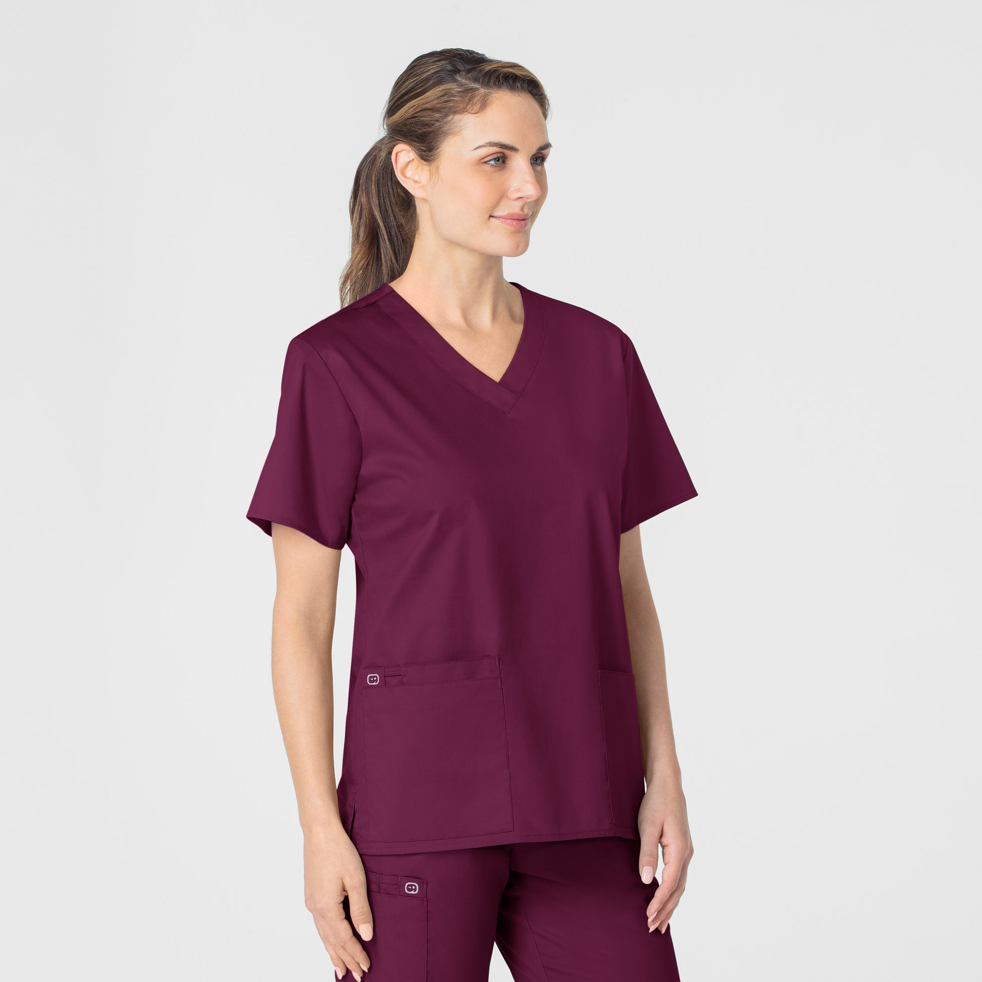 WonderWORK 101 V-Neck Scrub Top Wine Model Image Right Side | Wink