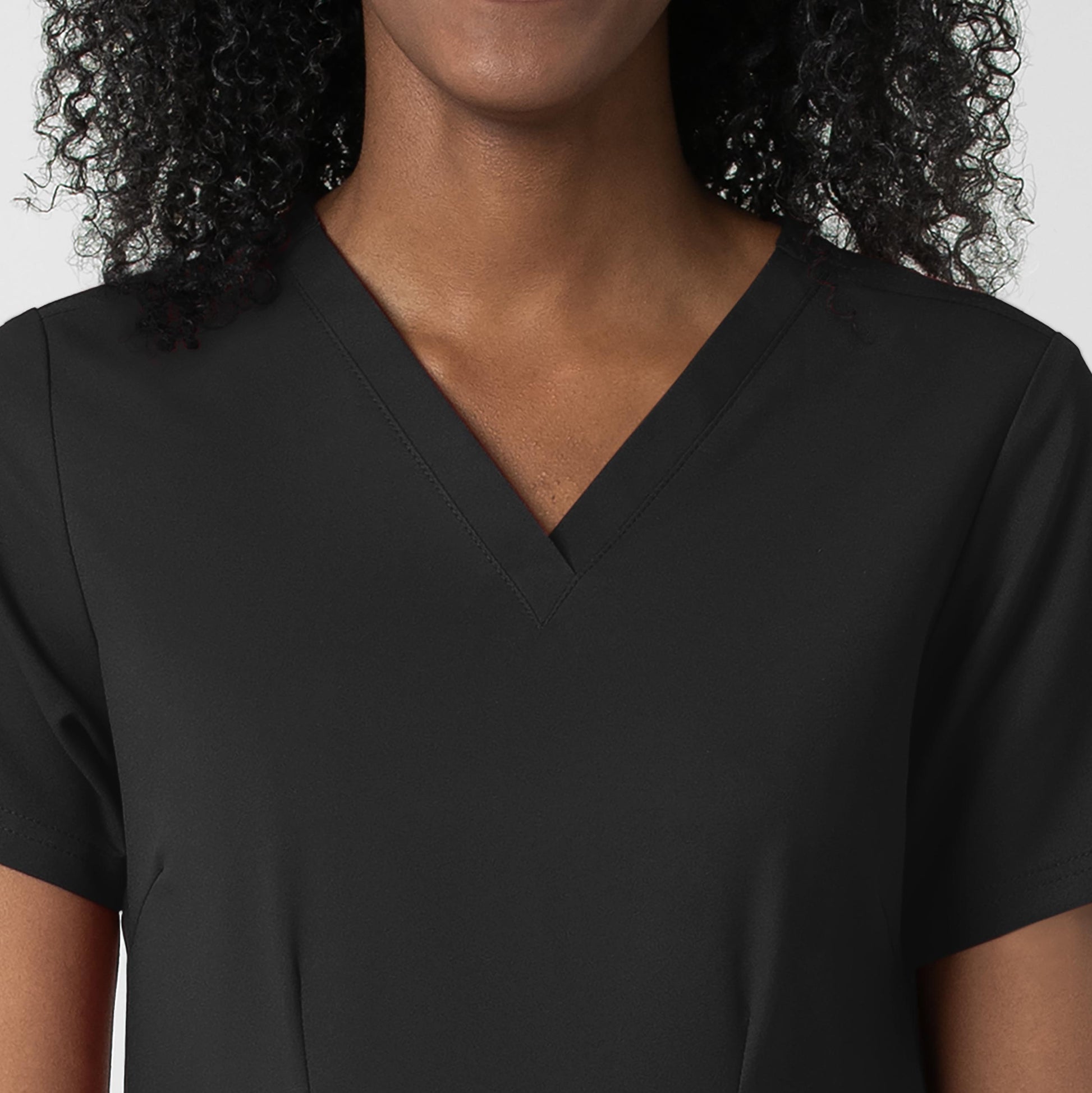 Thrive 6122 Fitted 3-Pocket V-Neck Scrub Top Black Model Image Left Side | Wink