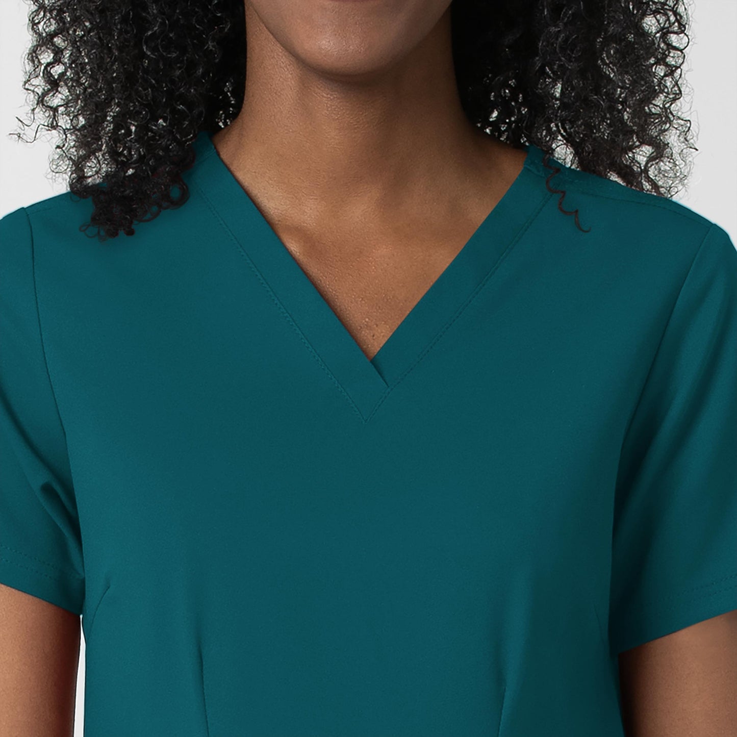 Thrive 6122 Fitted 3-Pocket V-Neck Scrub Top Caribbean Blue Model Image Left Side | Wink