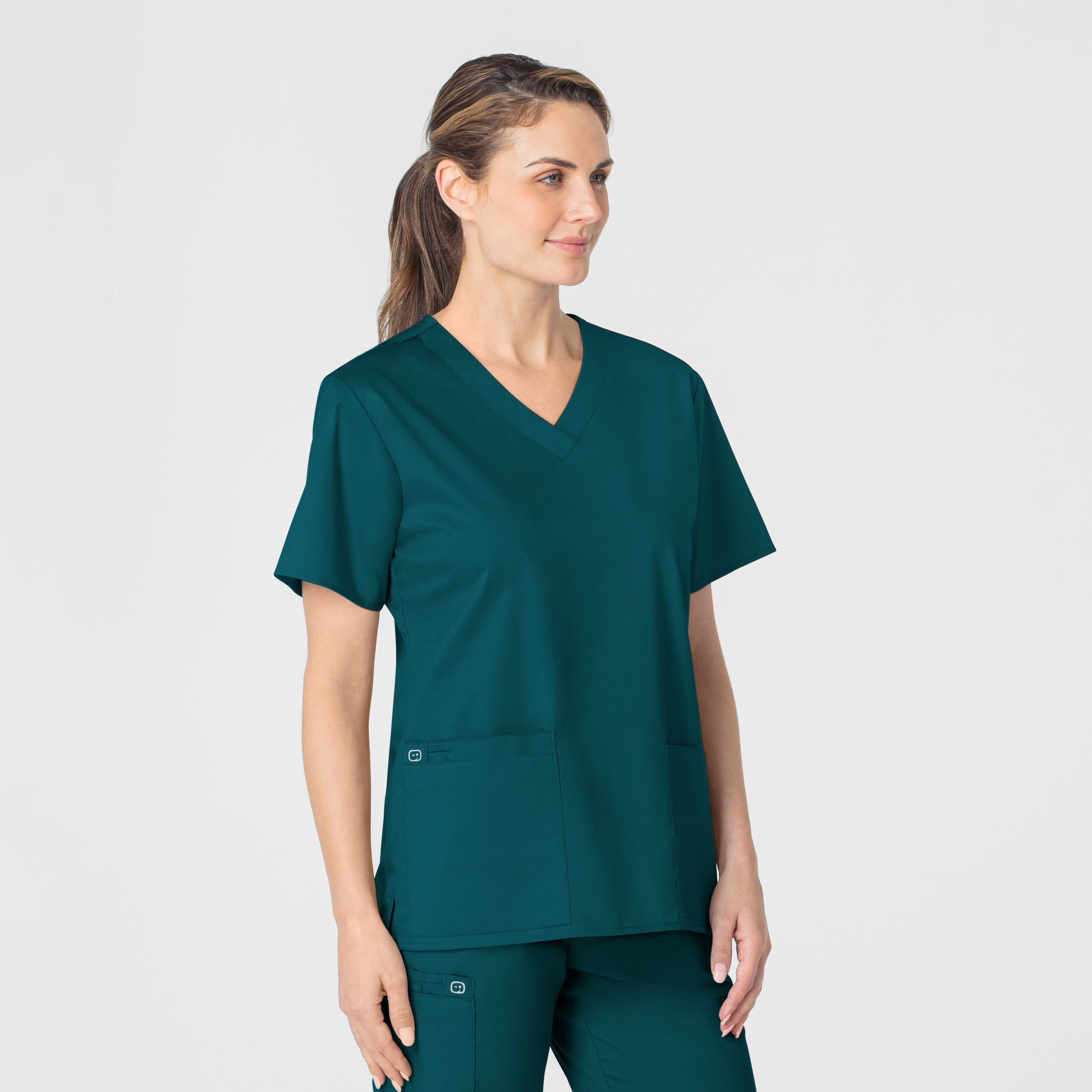 WonderWORK 101 V-Neck Scrub Top Caribbean Blue Model Image Left Side | Wink