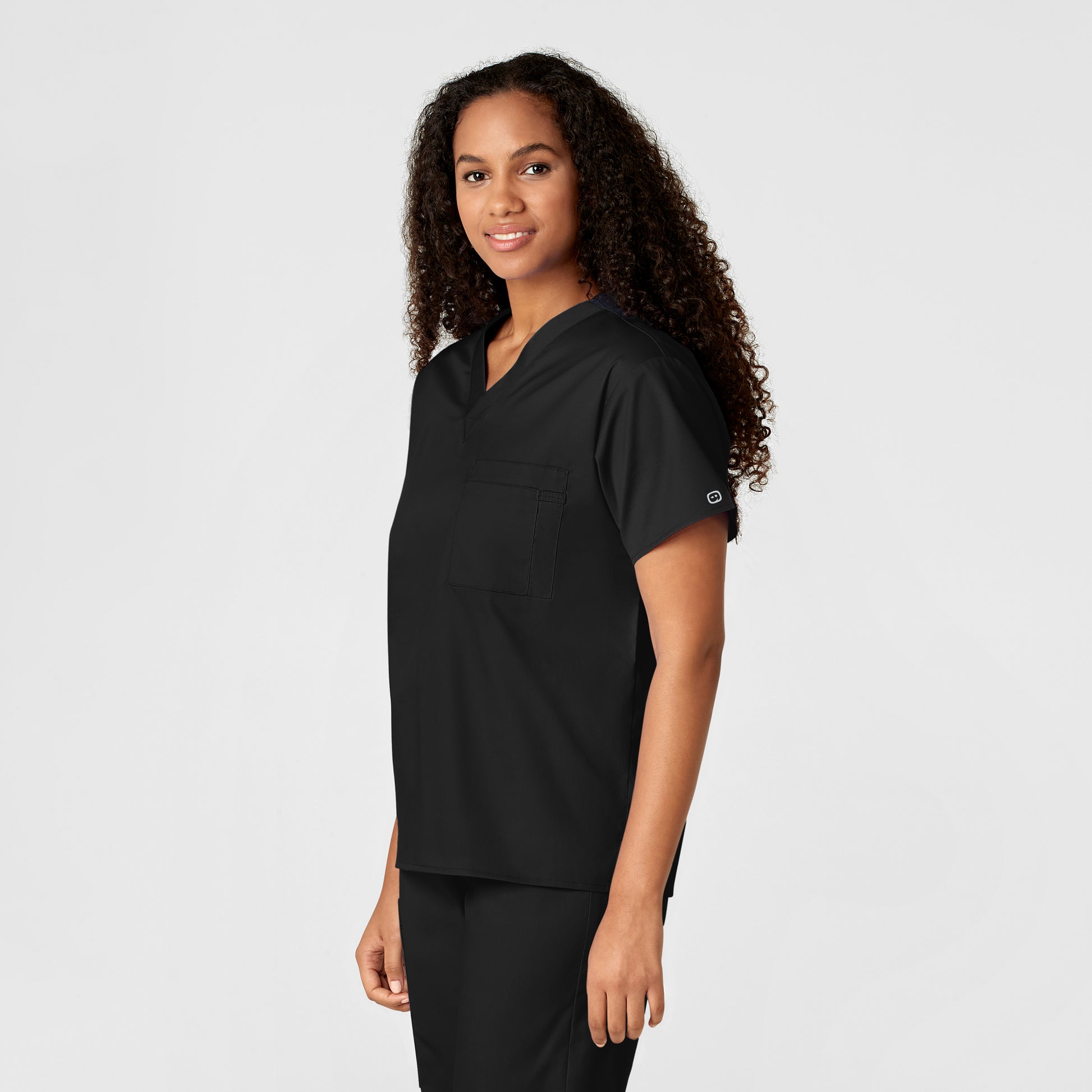 WonderWORK 100 Unisex V-Neck Scrub Top Black Model Image Right Side | Wink