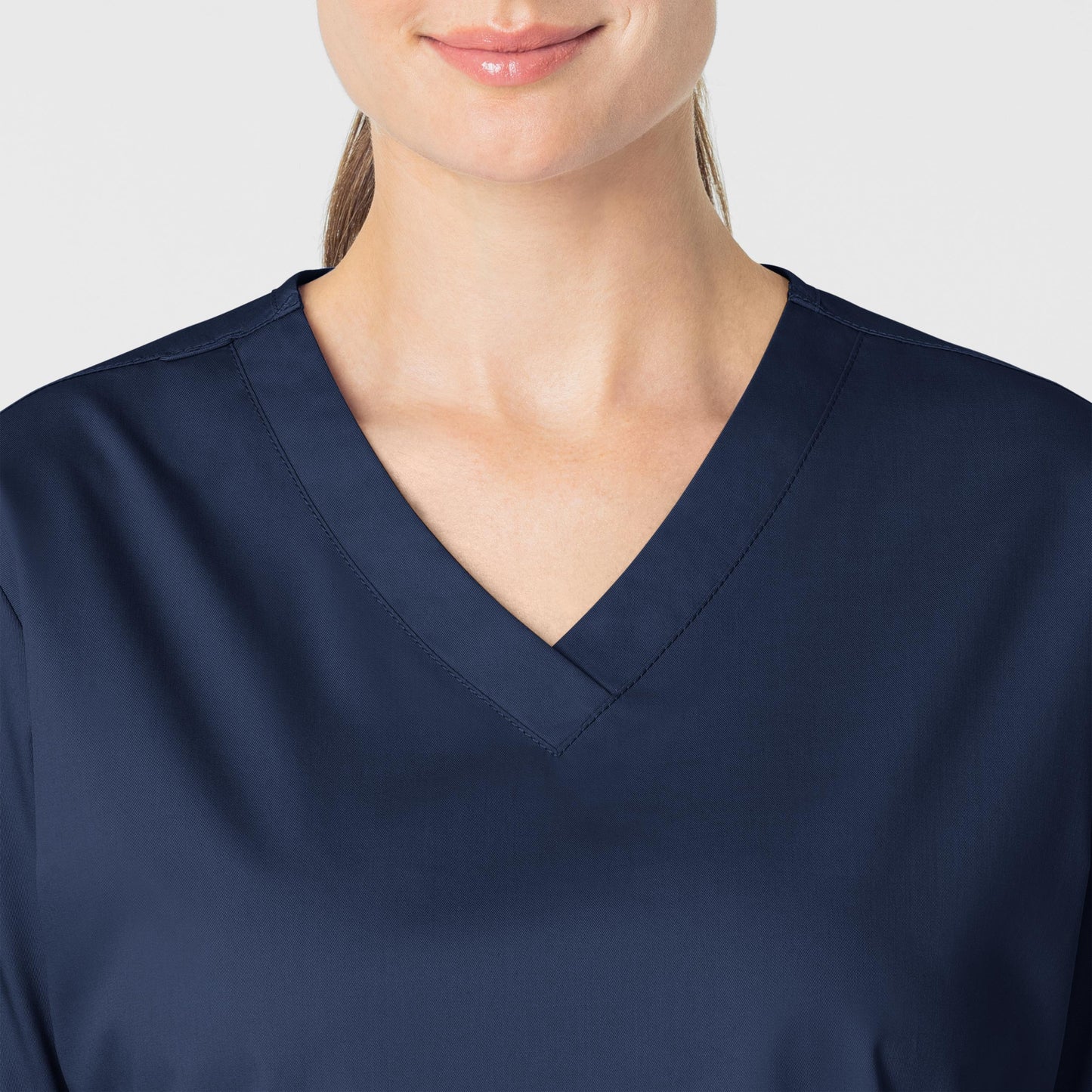 WonderWORK 101 V-Neck Scrub Top Navy Model Image Left Side | Wink