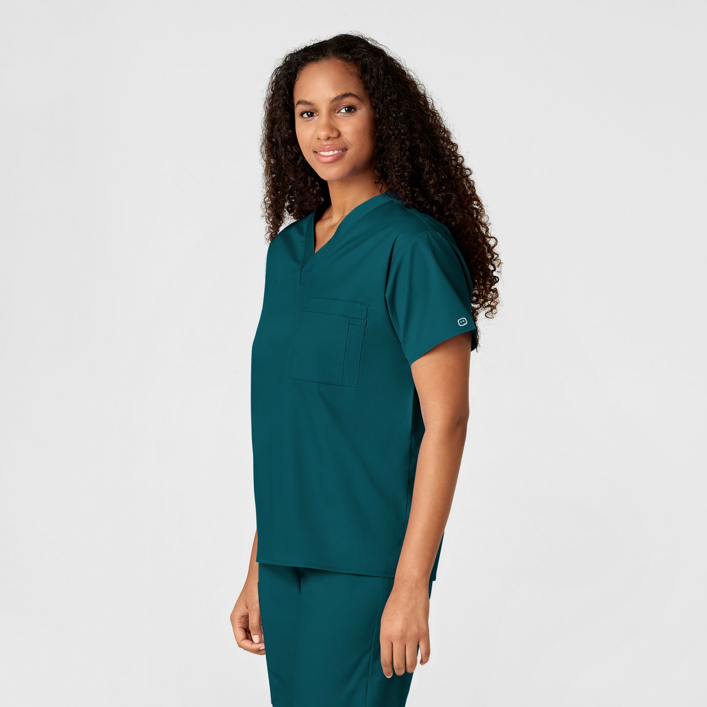 WonderWORK 100 Unisex V-Neck Scrub Top Caribbean Blue Model Image Left Side | Wink