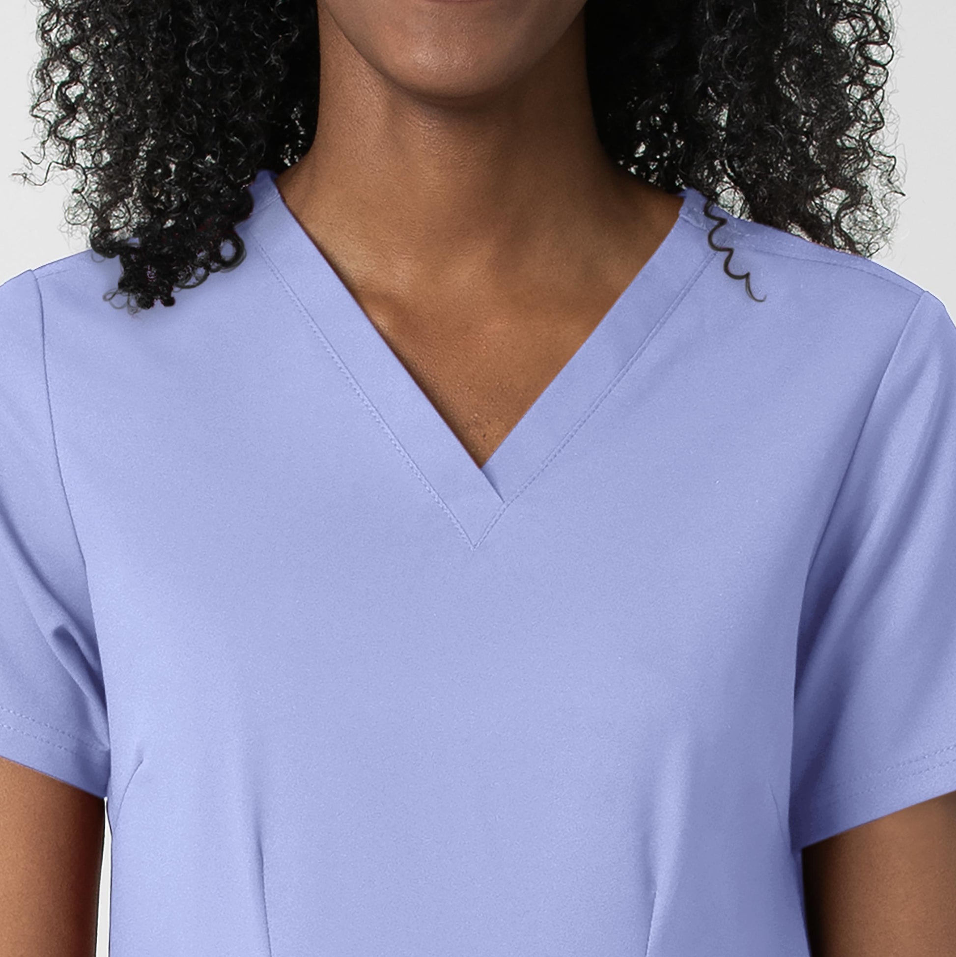 Thrive 6122 Fitted 3-Pocket V-Neck Scrub Top Ceil Blue Model Image Left Side | Wink