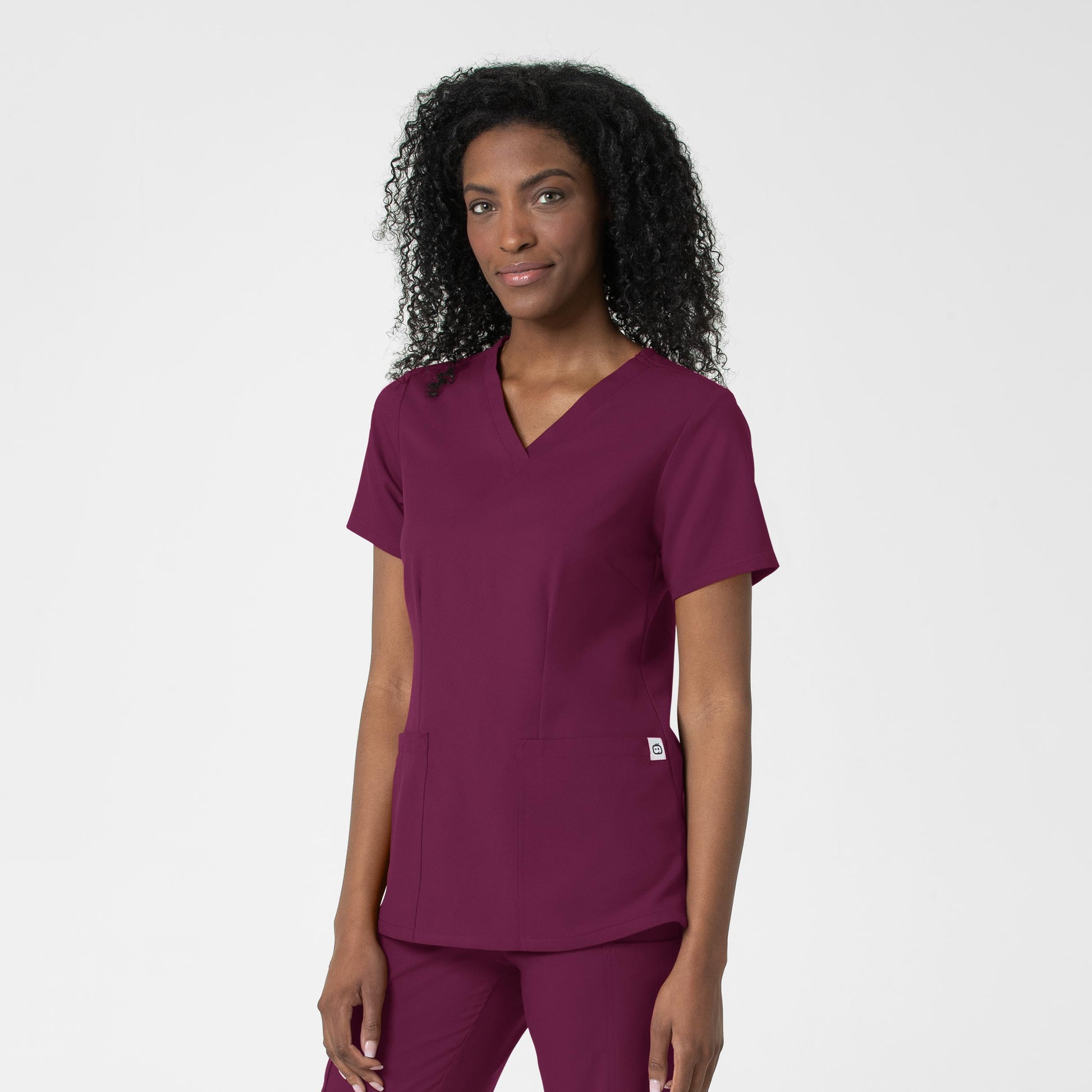 Thrive 6122 Fitted 3-Pocket V-Neck Scrub Top Wine Model Image Right Side | Wink