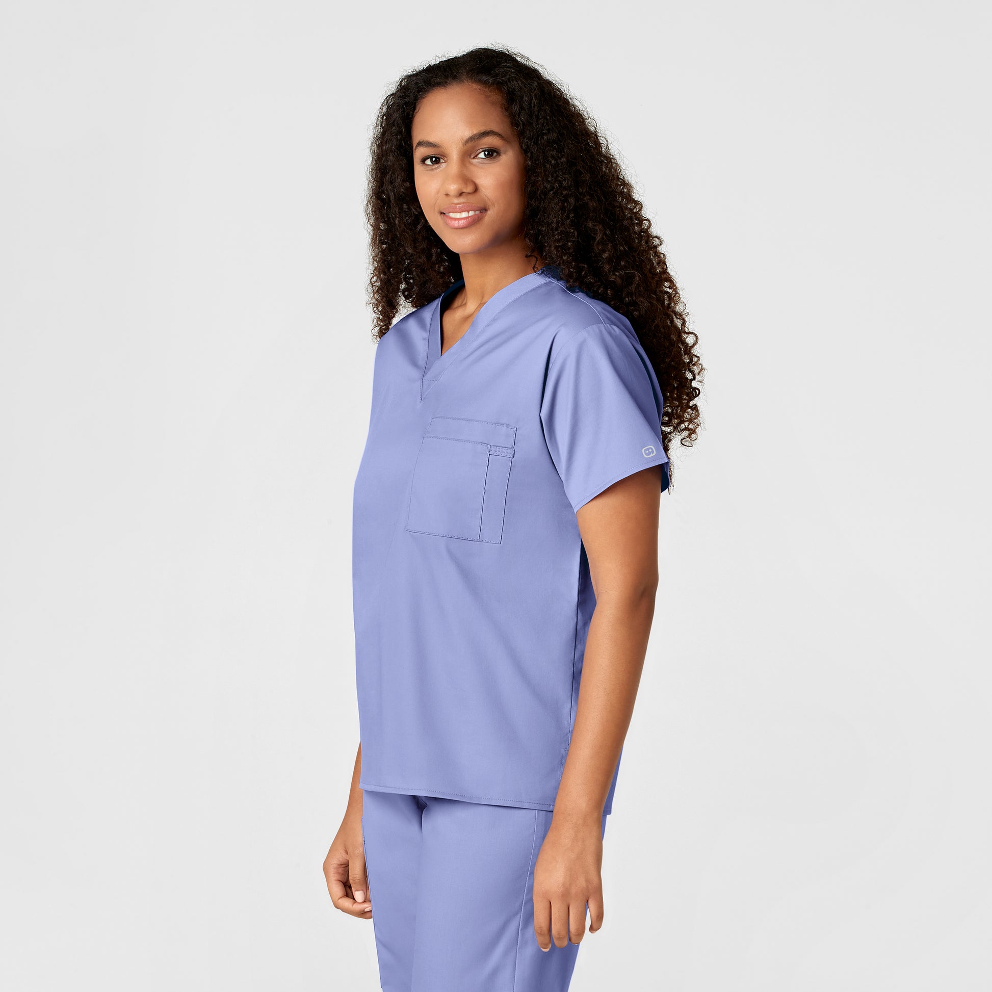 WonderWORK 100 Unisex V-Neck Scrub Top Ceil Blue Model Image Right Side | Wink