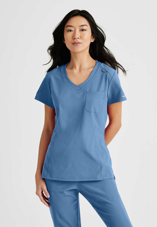 Skechers SKT147 Dignity Scrub Top Ciel Blue Model Image Front | Barco