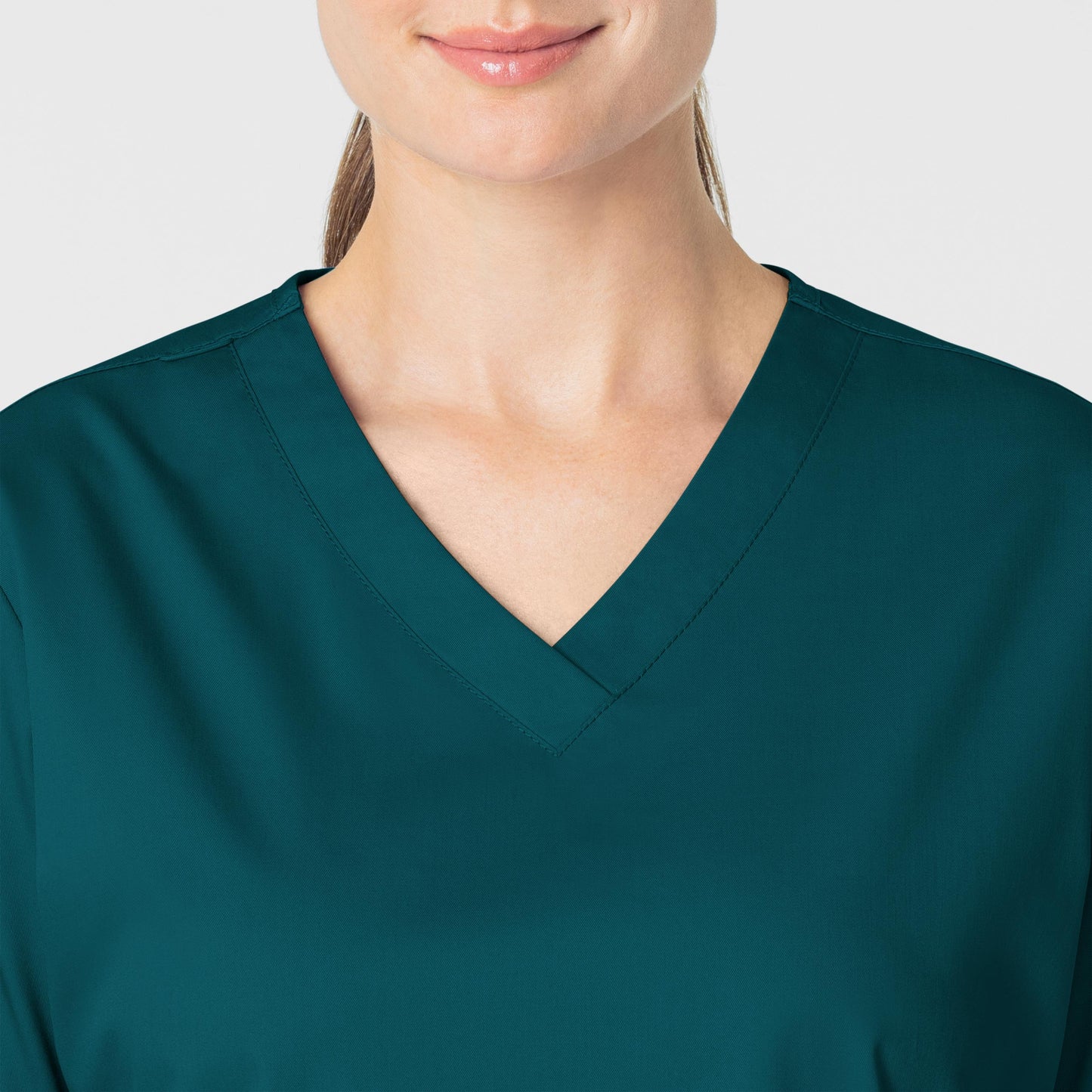 WonderWORK 101 V-Neck Scrub Top Caribbean Blue Model Image Alternate | Wink