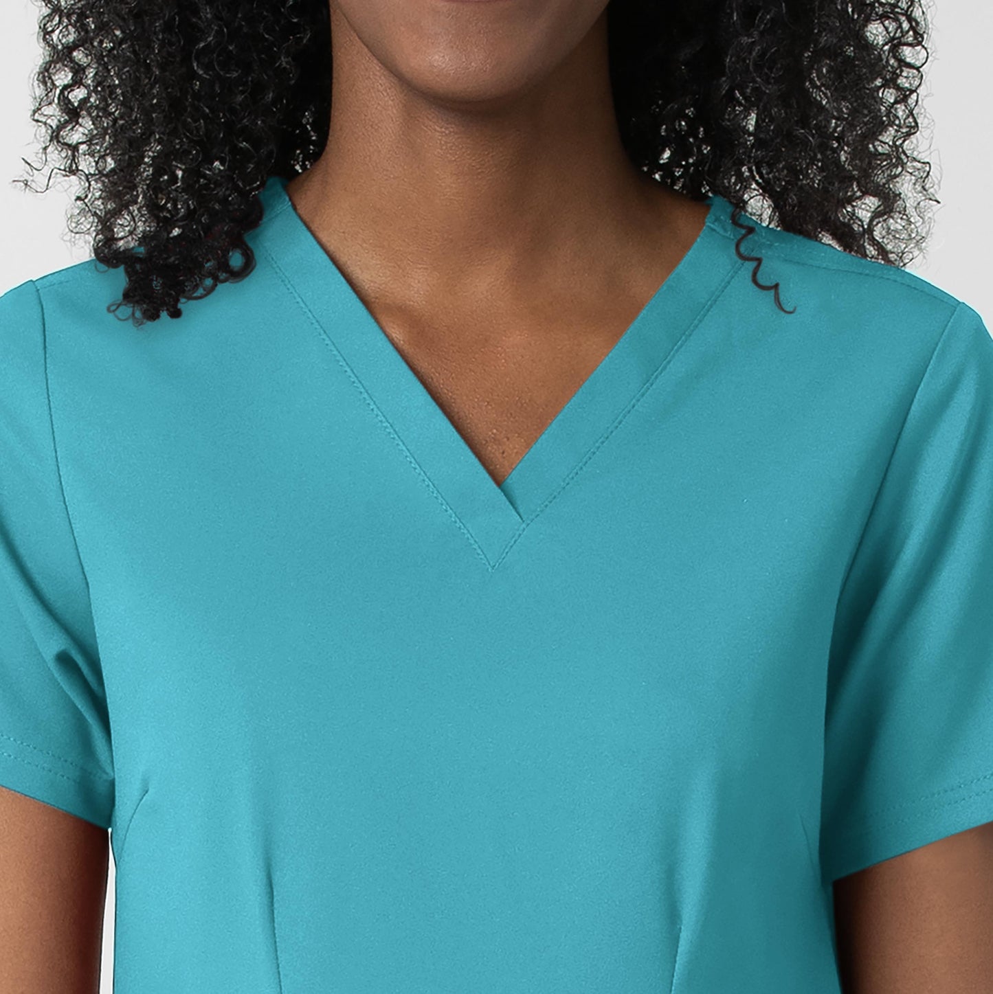 Thrive 6122 Fitted 3-Pocket V-Neck Scrub Top Teal Blue Model Image Left Side | Wink