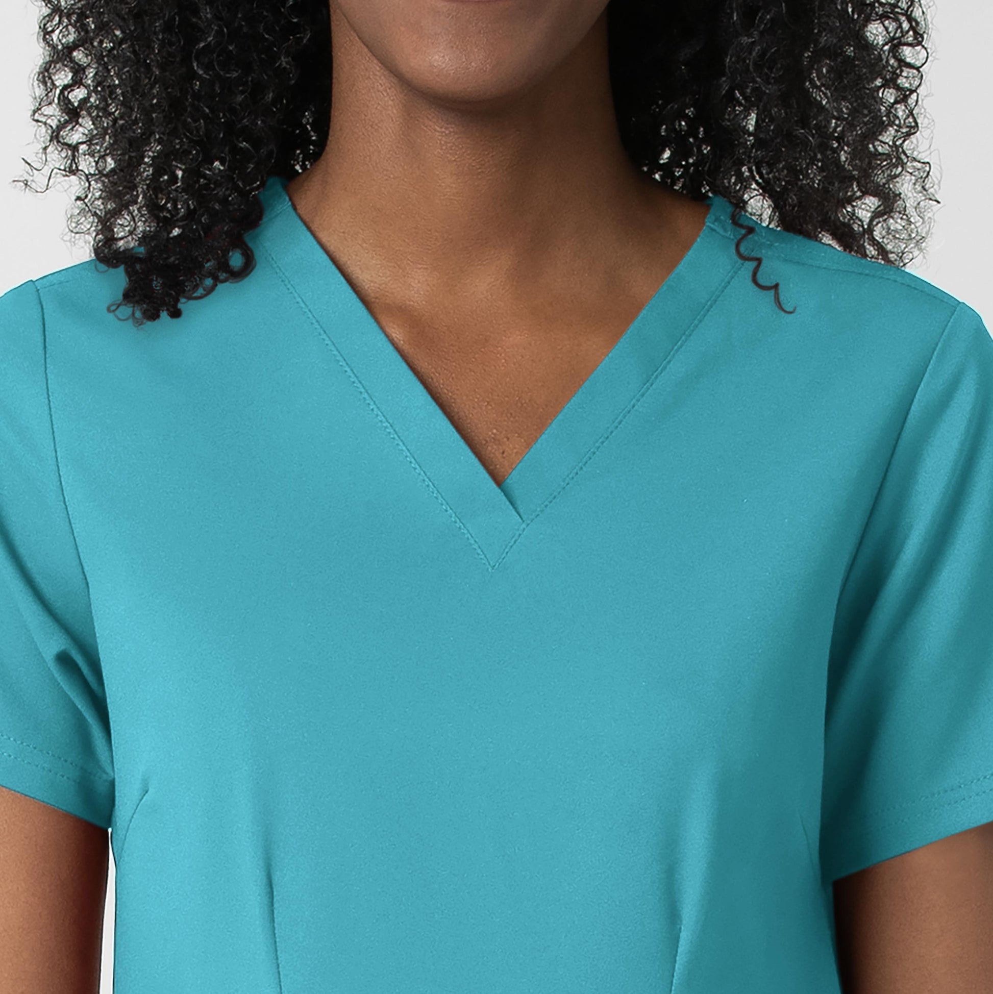 Thrive 6122 Fitted 3-Pocket V-Neck Scrub Top Teal Blue Model Image Left Side | Wink