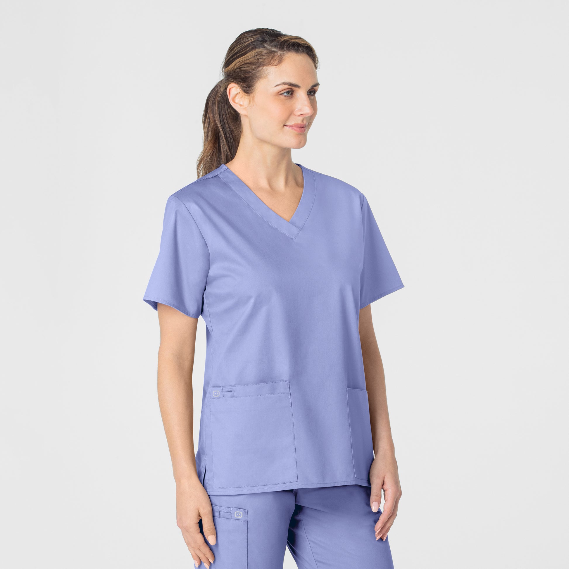 WonderWORK 101 V-Neck Scrub Top Ceil Blue Model Image Right Side | Wink