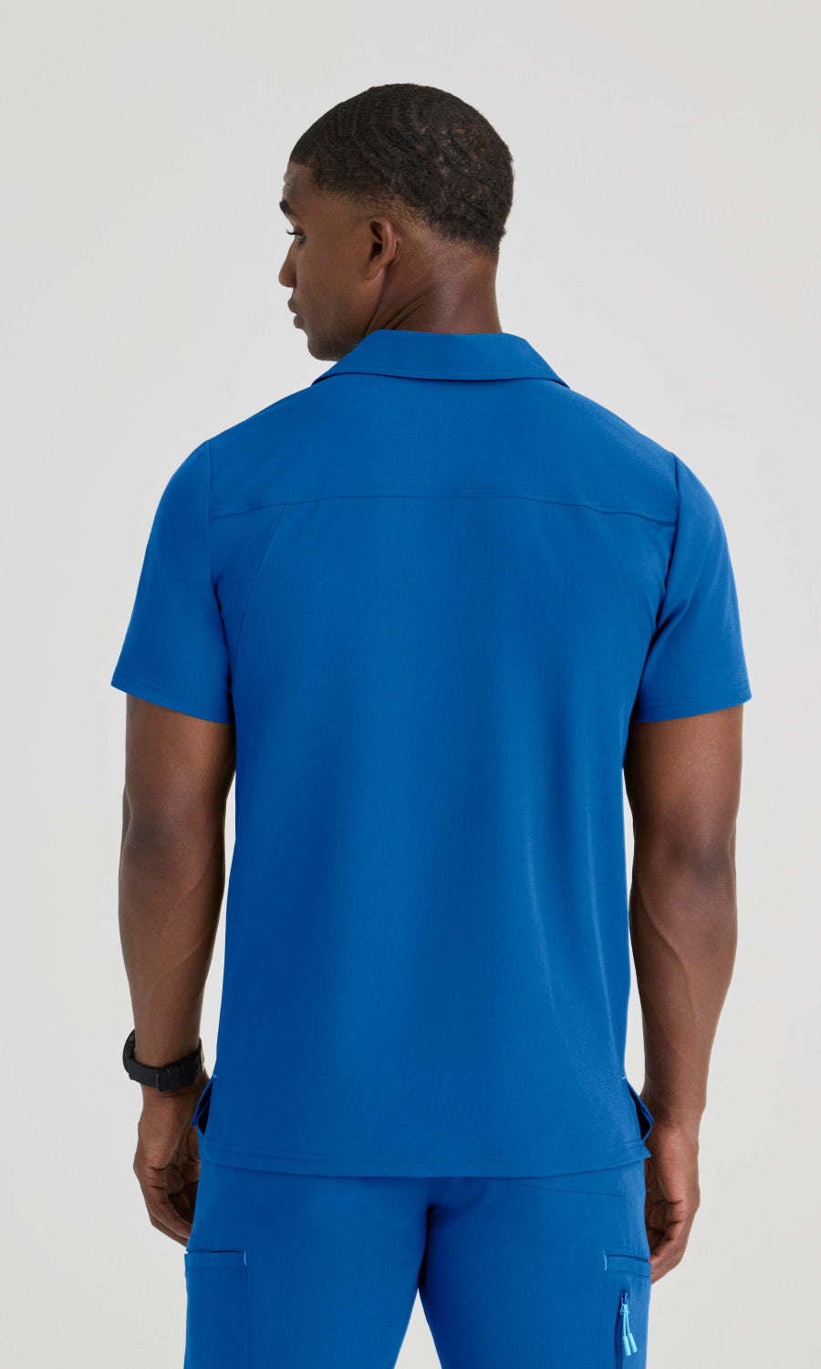 Skechers SKT305 Men's Merit Top in New Royal by Barco Model Image Back