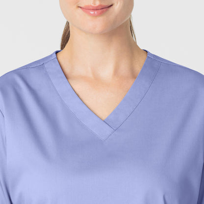 WonderWORK 101 V-Neck Scrub Top Ceil Blue Model Image Left Side | Wink